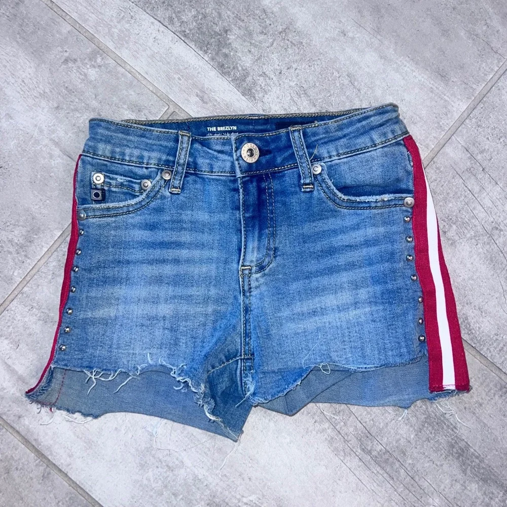 AG Girls Size12 cut off denim jean shorts with red & white stripe & studs. High/